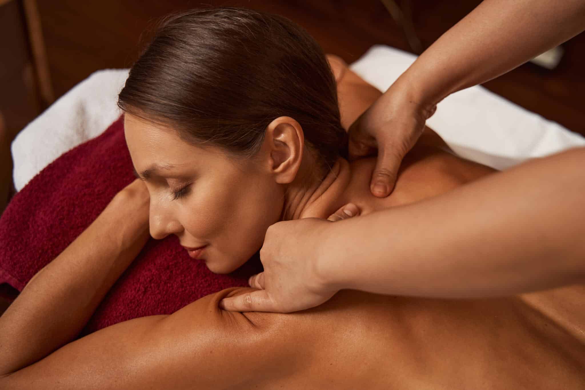 beauty salon customer getting trigger point massage