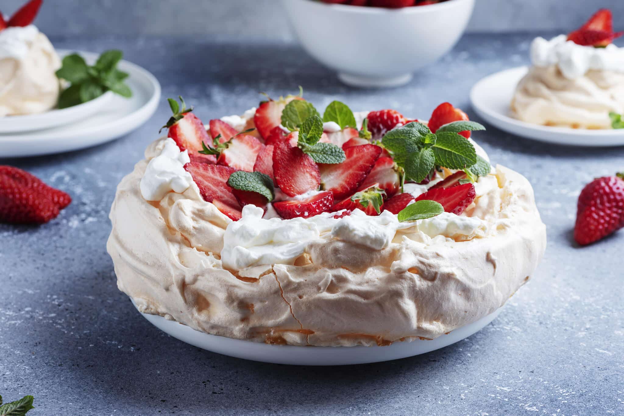 cake pavlova with meringue, strawberry and cream